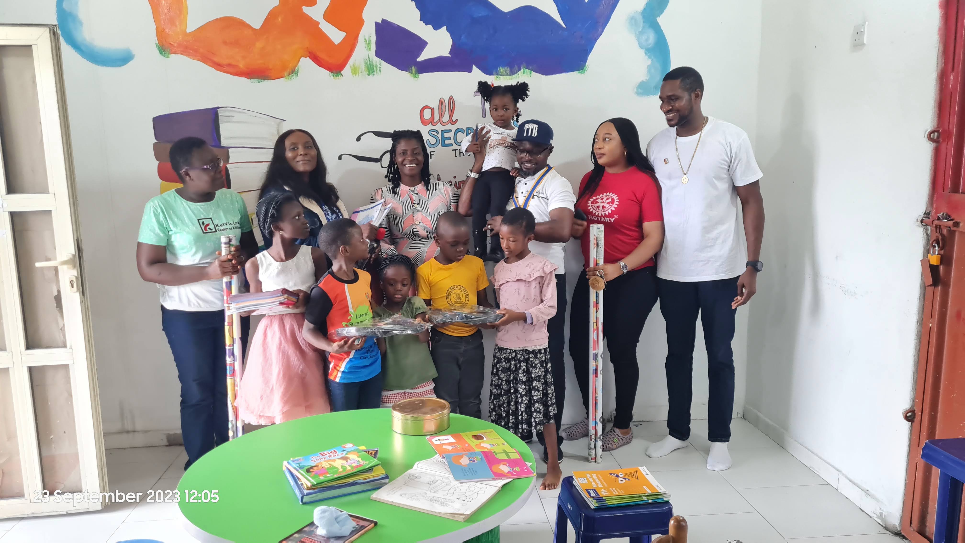Rotary Club of Bonny Island members sharing books and learning materials with children